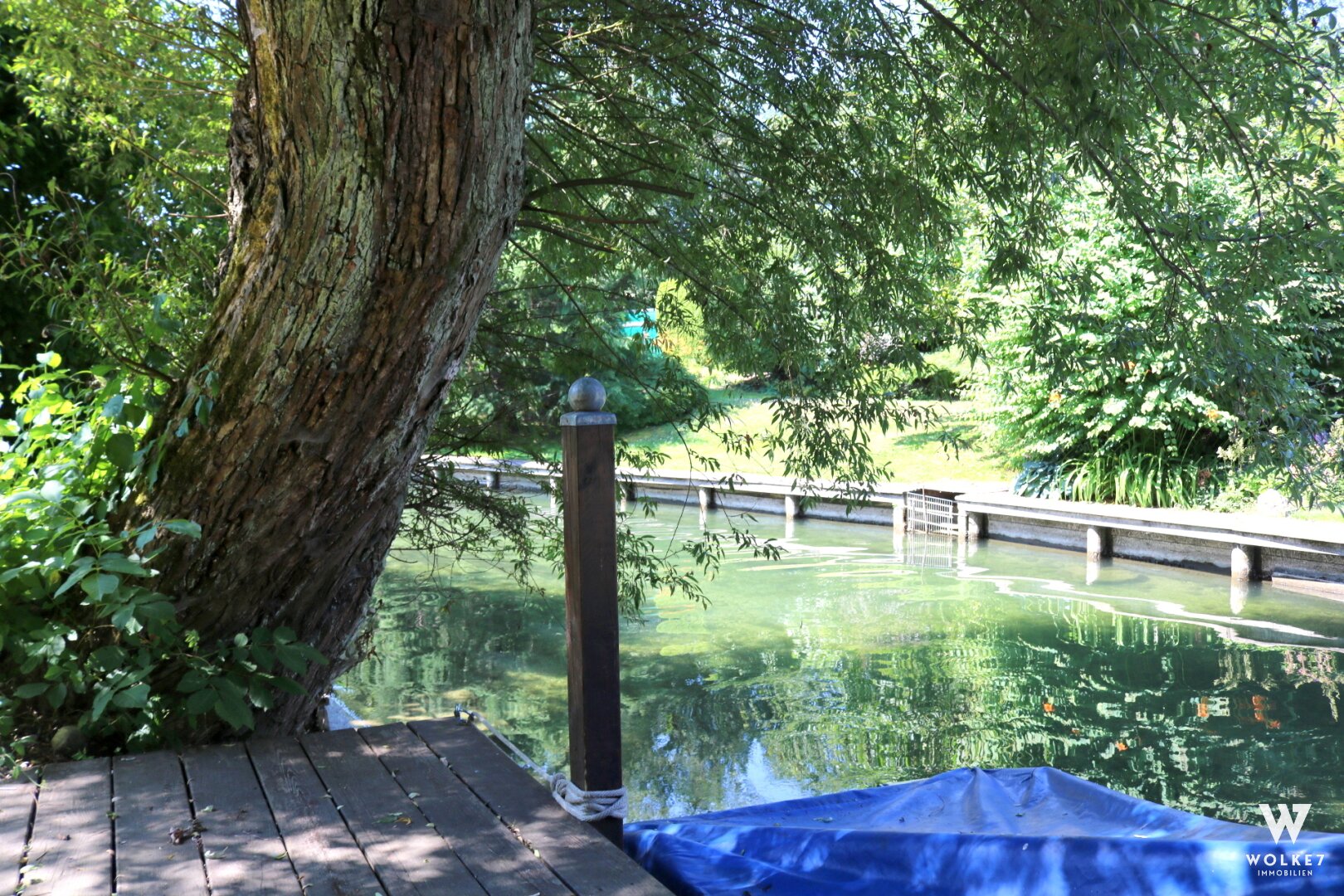 Toller Baugrund mit Bootsanlegestelle und Ferienhäuschen am Ausgang des Ossiachersees